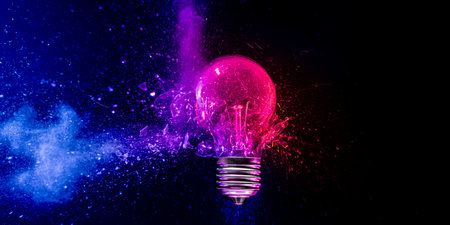 light bulb exploding blue pink powder black background