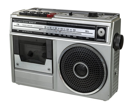 Classic silver radio cassette recorder with large speaker and manual tuning dial isolatedの写真素材