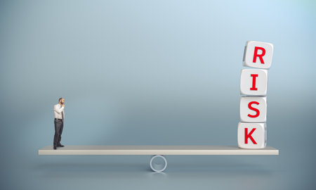 Businessman standing balancing seesaw contemplating risk says cubesの写真素材