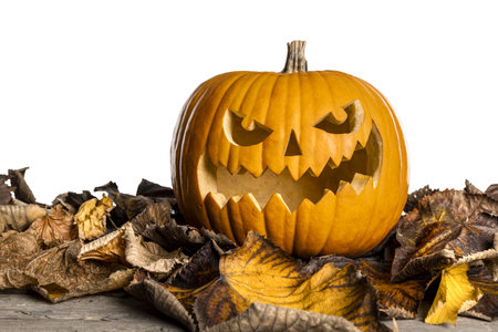 Carved halloween pumpkin jack o' lantern autumn leaves transparent backgroundの写真素材