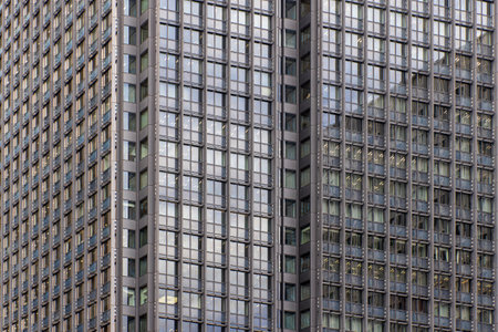Modern office buildings showing repeating glass windowsの写真素材