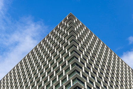 Modern building facade with repeating geometric patternの写真素材