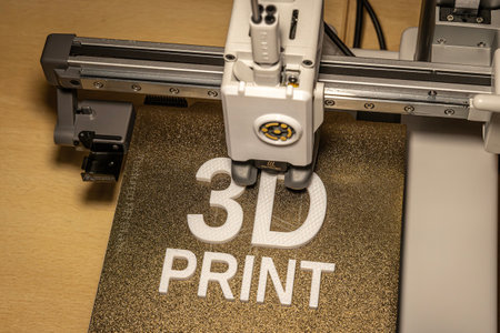 Modern 3d printer creating the words in white petg
