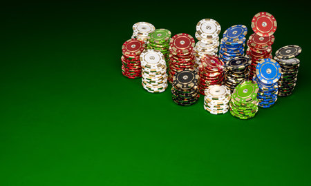 poker chips stacked on green table. casino gambling 3d backgroundの写真素材