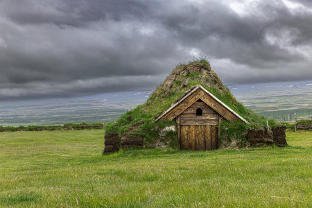 Traditional icelandic turf church with green roof and wooden doorの写真素材