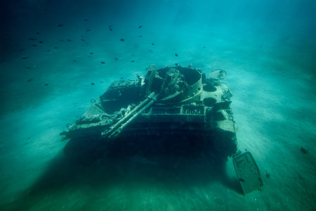 Sunken military tank resting on the ocean floorの写真素材