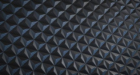 Dark blue and black carbon fiber forming triangular patternの写真素材