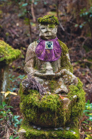 Jizo statue wearing a purple bib koyasan okunoinの写真素材
