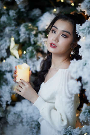 Ho Chi Minh City, Vietnam: Portrait of a lovely Vietnamese girl in a white short dressの写真素材