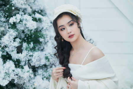 Ho Chi Minh City, Vietnam: Portrait of a lovely Vietnamese girl in a white short dressの写真素材