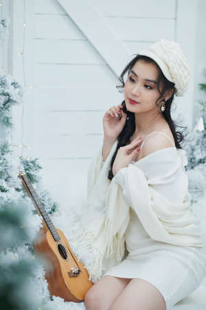 Ho Chi Minh City, Vietnam: Portrait of a lovely Vietnamese girl in a white short dressの写真素材