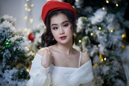 Ho Chi Minh City, Vietnam: Portrait of a lovely Vietnamese girl in a white short dressの写真素材