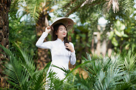 Ho Chi Minh City, Vietnam: Portrait women in white ao dai Vietnam, The Ao dai ( long-dress Vietnamese) is traditional costume of Vietnamese womanの写真素材