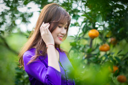 Ho Chi Minh City, Vietnam: Portrait women in white ao dai Vietnam, The Ao dai ( long-dress...