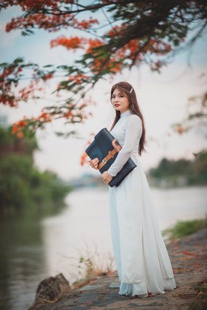 Ho Chi Minh City, Vietnam: Portrait women in white ao dai Vietnam, The Ao dai ( long-dress...