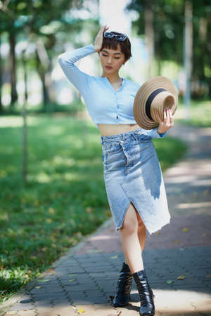 Ho Chi Minh city, Viet Nam: Beautiful Vietnamese girl posing for a personality photo in the park