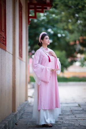 Ho Chi Minh city, Viet Nam: Vietnamese girl going to pagoda in ao dai