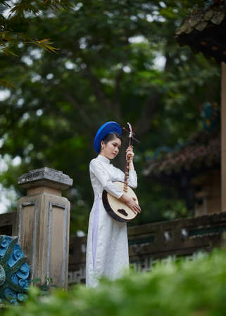 Ho Chi Minh City, Vietnam: Portrait women in white ao dai Vietnam, The Ao dai ( long-dress...