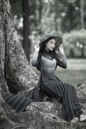 Ho Chi Minh city, Viet Nam: Ao Dai, Beautiful girl in Vietnamese traditional costumeの写真素材
