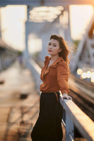 Ho Chi Minh city, Viet Nam: Portrait of a beautiful Vietnamese girl in the sunset