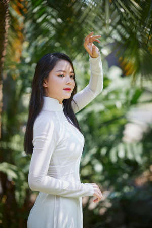 Ho Chi Minh City, Vietnam: Portrait women in white ao dai Vietnam, The Ao dai ( long-dress Vietnamese) is traditional costume of Vietnamese womanの写真素材