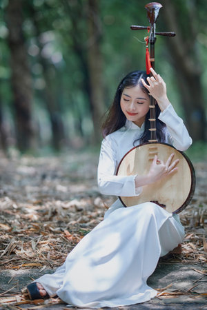 Ho Chi Minh City, Vietnam: Portrait women in white ao dai Vietnam, The Ao dai ( long-dress Vietnamese) is traditional costume of Vietnamese womanの写真素材