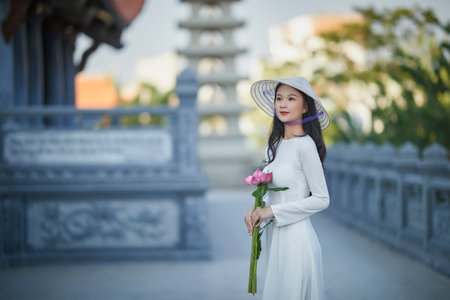 Ho Chi Minh City, Vietnam: Portrait women in white ao dai Vietnam, The Ao dai ( long-dress...