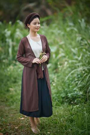 Ho Chi Minh City, Vietnam: beautiful girl in Vietnam traditional dress (costume Vietnamese name called Yem)の写真素材