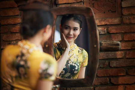 Ho Chi Minh City, Vietnam: Portrait of a beautiful Vietnamese girl in cheongsamの写真素材