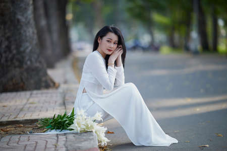 Ho Chi Minh City, Vietnam: Portrait women in white ao dai Vietnam, The Ao dai ( long-dress Vietnamese) is traditional costume of Vietnamese womanの写真素材
