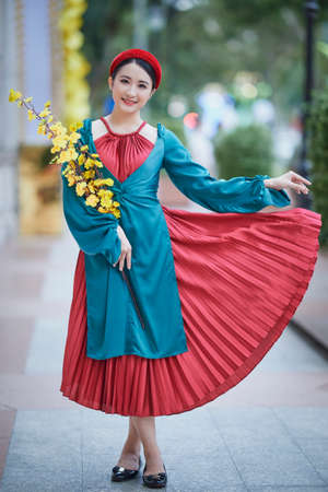 Ho Chi Minh City, Vietnam: Beautiful Vietnamese girl in traditional clothes to celebrate the lunar new yearの写真素材