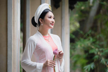 Ho Chi Minh City, Vietnam: Vietnamese girls go to pagodas with traditional costumes and lotus...