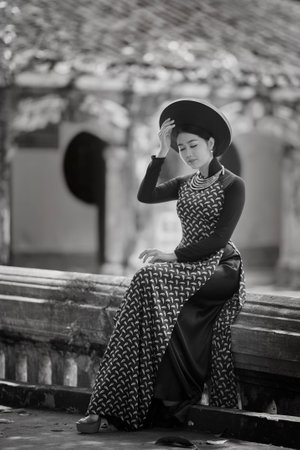 Ho Chi Minh city, Viet Nam: Vietnamese girl going to pagoda in ao daiの写真素材