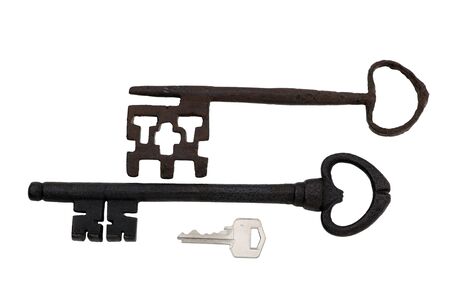 a rusted old fashion key over a white backgroundの写真素材