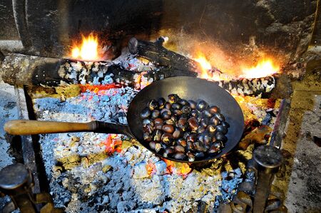 roasted chestnuts in the fireplace, French traditionの写真素材
