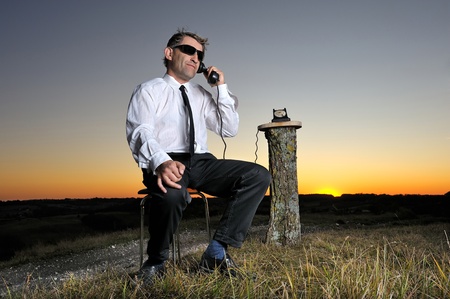 a businessman who phone in the countrysideの写真素材