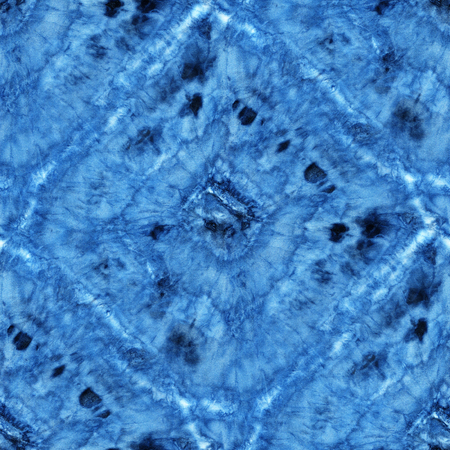 Seamless tie-dye pattern of indigo color on white silk. Hand painting fabrics - nodular batik....