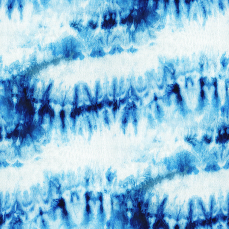 Seamless tie-dye pattern of indigo color on white silk. Hand painting fabrics - nodular batik. Shibori dyeing.の写真素材