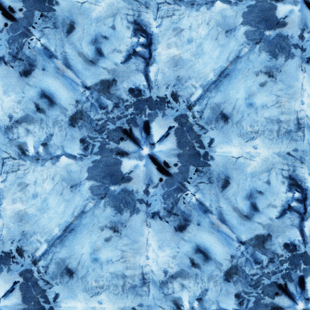 Seamless tie-dye pattern of indigo color on white silk. Hand painting fabrics - nodular batik. Shibori dyeing.の写真素材