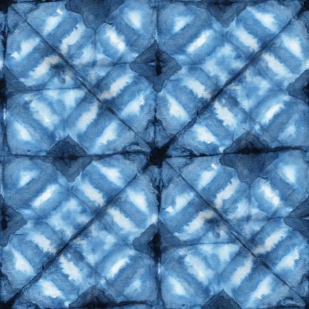 Seamless tie-dye pattern of indigo color on white silk. Hand painting fabrics - nodular batik. Shibori dyeing.の写真素材
