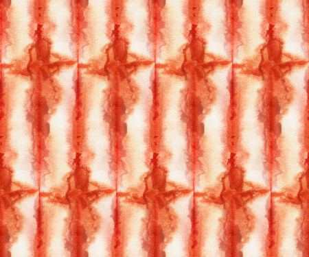 Seamless tie-dye pattern of  orange color on white silk. Hand painting fabrics - nodular batik. Shibori dyeing. の写真素材