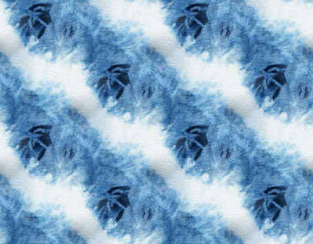 Seamless tie-dye pattern of indigo color on white silk. Hand painting fabrics - nodular batik. Shibori dyeing.の写真素材