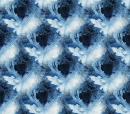 Seamless tie-dye pattern of indigo color on white silk. Hand painting fabrics - nodular batik....