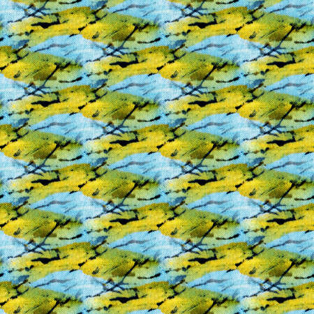 Seamless tie-dye pattern of indigo and yellow color on white silk. Hand painting fabrics - nodular batik. Shibori dyeing.の写真素材