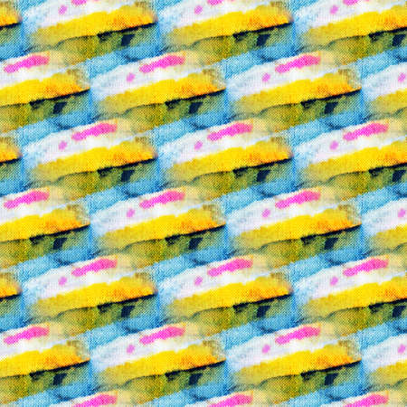 Seamless tie-dye pattern of indigo and yellow color on white silk. Hand painting fabrics - nodular batik. Shibori dyeing.の写真素材
