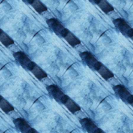 Seamless tie-dye pattern of indigo color on white silk. Hand painting fabrics - nodular batik....