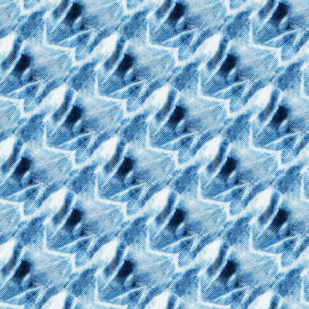 Seamless tie-dye pattern of indigo color on white silk. Hand painting fabrics - nodular batik....