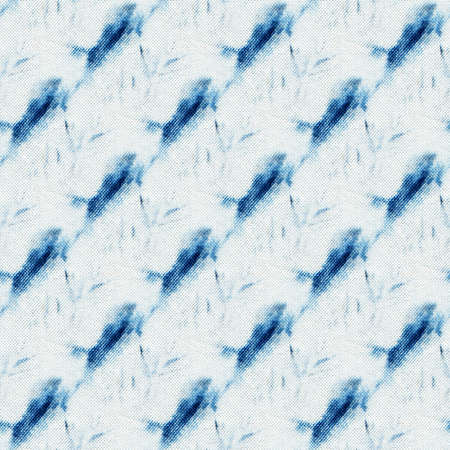 Seamless tie-dye pattern of indigo color on white silk. Hand painting fabrics - nodular batik. Shibori dyeing.の写真素材