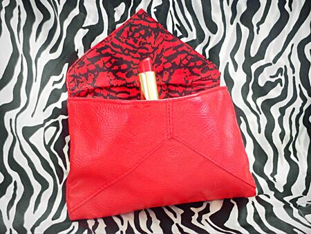 Red lipstick in red bagの写真素材