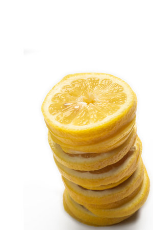 Sliced lemon over white background with copy space for your textの写真素材